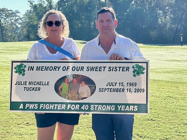 Siblings, Ken Tucker, Lake Jackson, and Lisa Tucker, Dallas, volunteered by placing hole sponsor signs. Ken and Lisa traveled to the event to honor the memory of their sister, Julie.